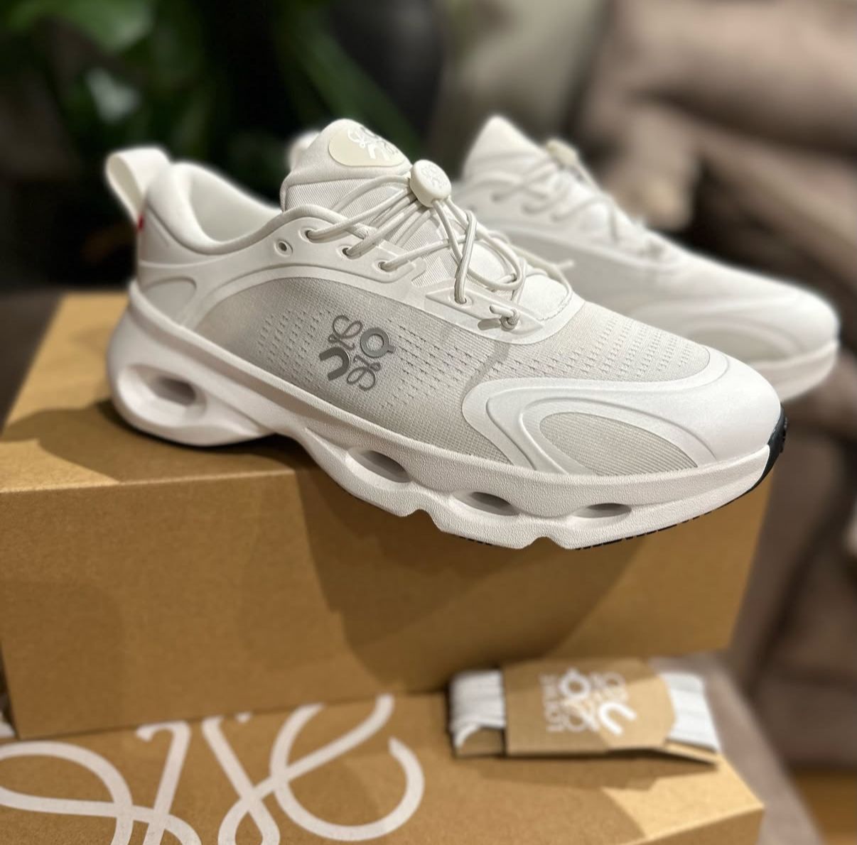 Shop On Running Cloudsolo Sneakers in White at Goat-ae.com — Swiss-engineered sneakers featuring CloudTec® cushioning, Helion™ foam, and a minimalist all-white design for everyday UAE comfort and style.